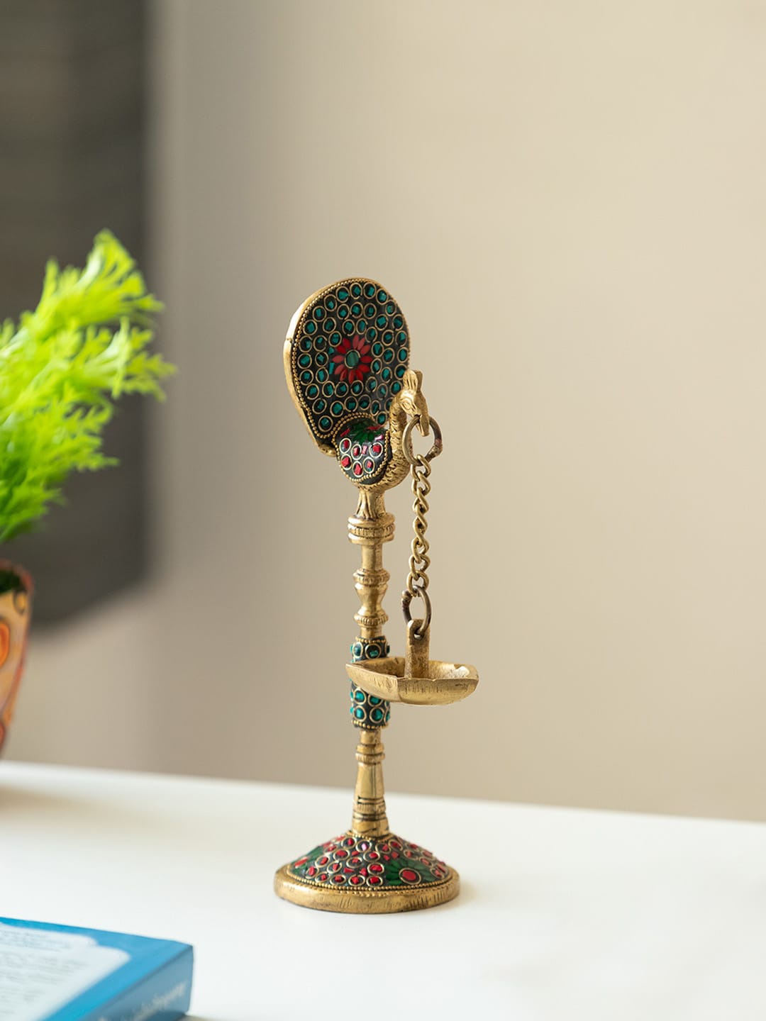 

ExclusiveLane Gold-Toned Textured Brass Peacock Shaped Table Hanging Diya