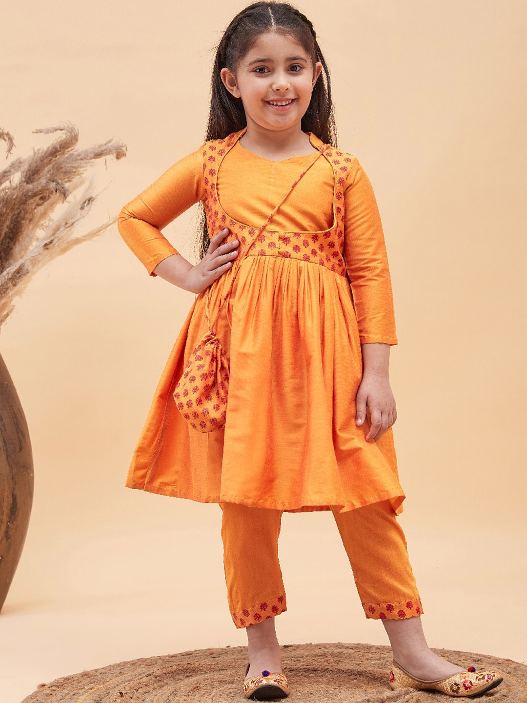 

VASTRAMAY Girls Floral Printed Pleated Anarkali Kurta with Pyjamas & Potli Bag, Mustard