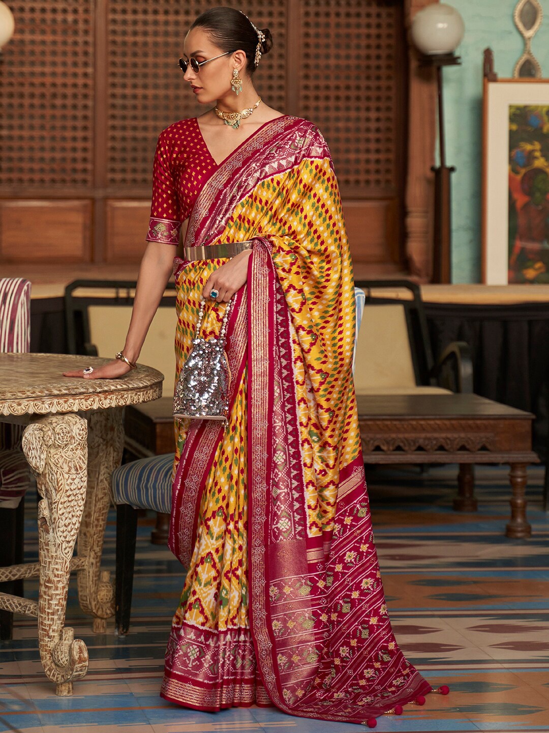 

Anouk Ethnic Motifs Printed Patola Saree, Yellow