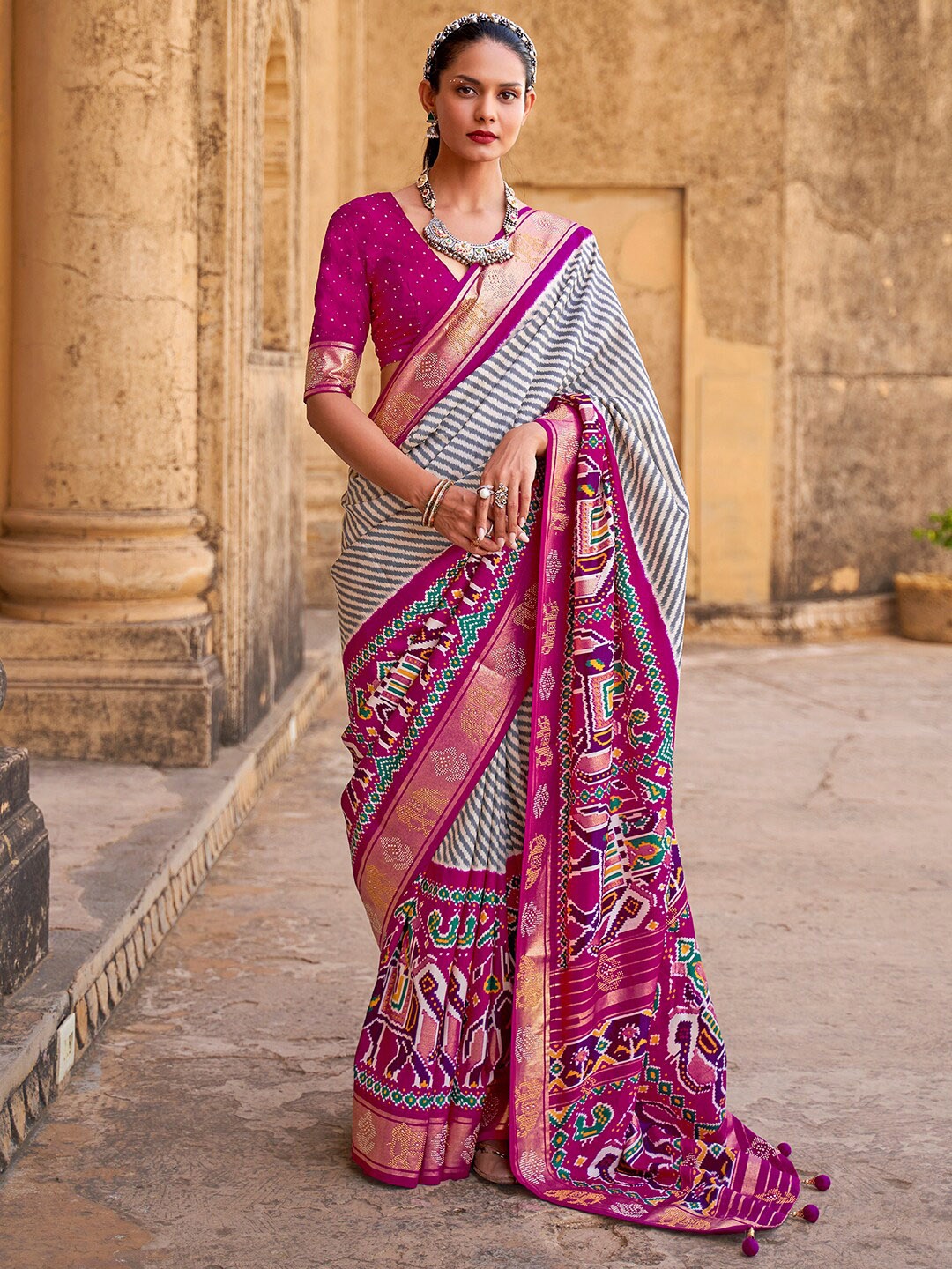 

Anouk Striped Ethnic Motifs Patola Saree With Zari Border, Pink