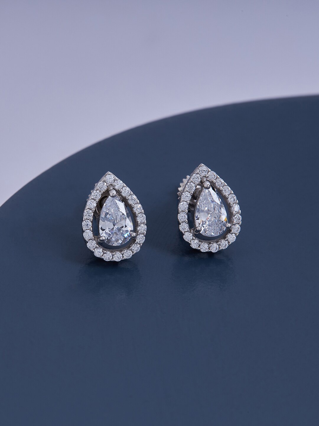 

Kushal's Fashion Jewellery White Teardrop Shaped Studs Earrings