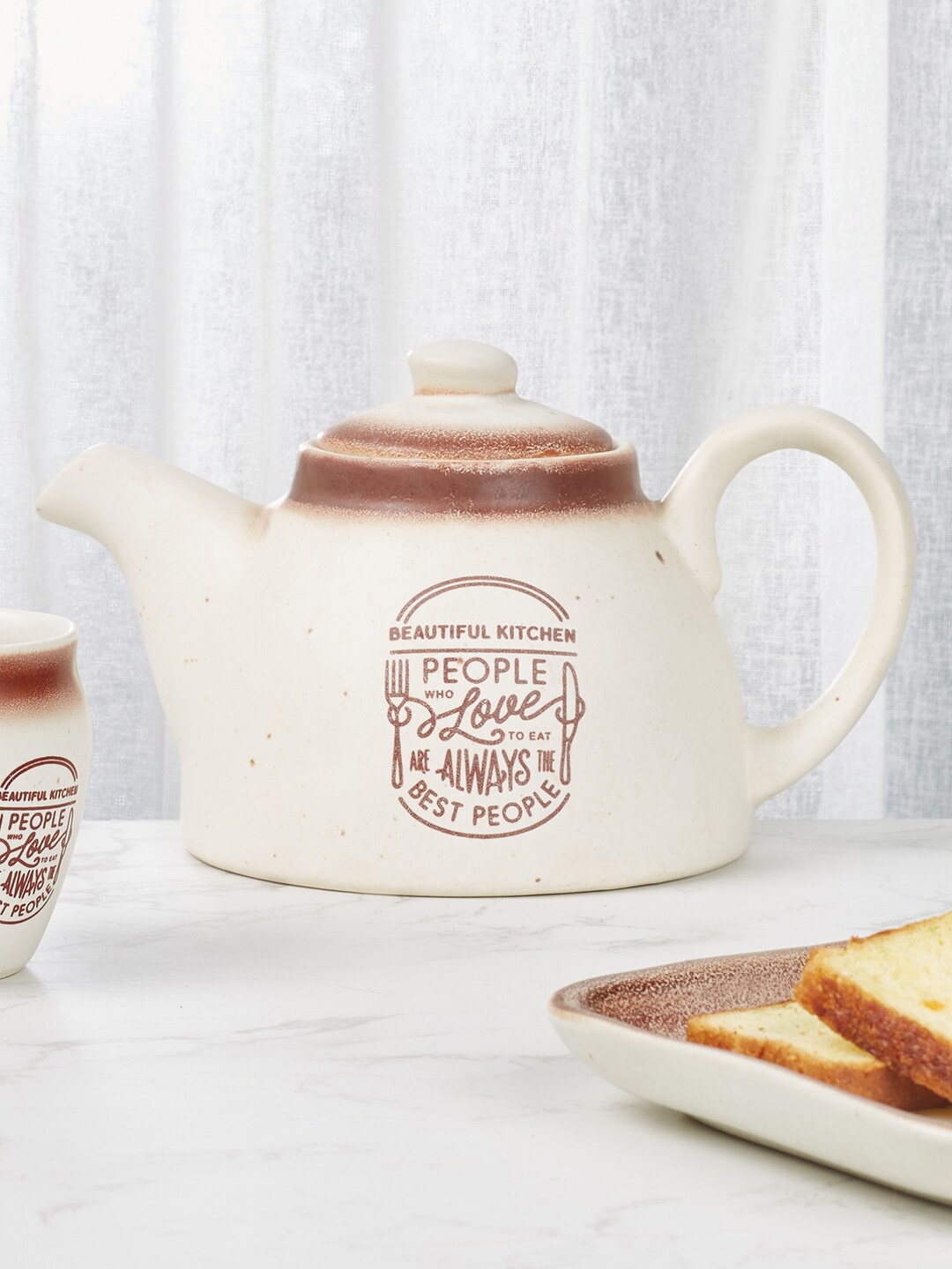 

HomeTown Beautiful Kitchen Off White & Brown Printed Stoneware Matte Kettle 100 ml