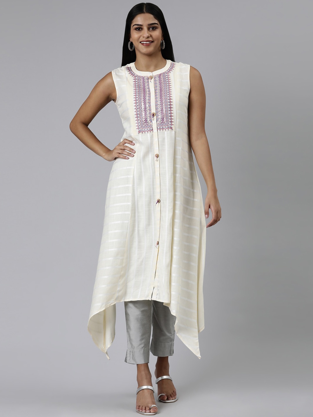 

Neerus Ethnic Motif Yoke Design Sleeveless Thread Work Asymmetric Kurta, Cream