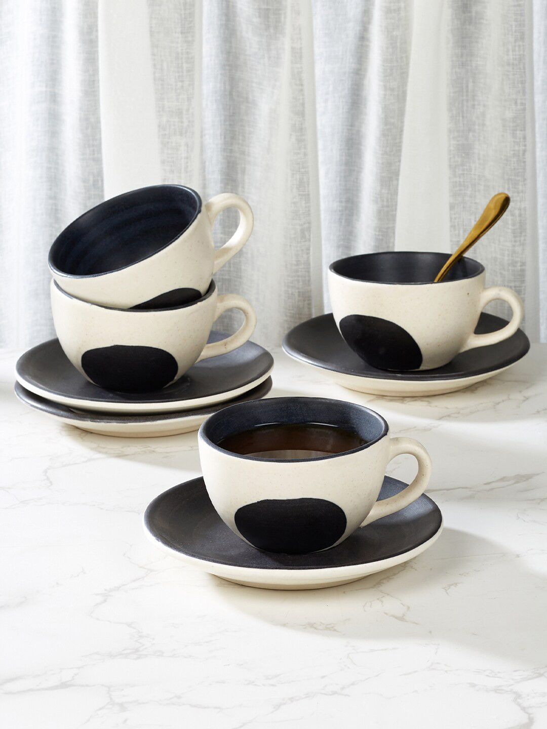 

HomeTown Artisanal Studio Off White & Black 8 Pieces Stoneware Cups & Saucers 180ml Each