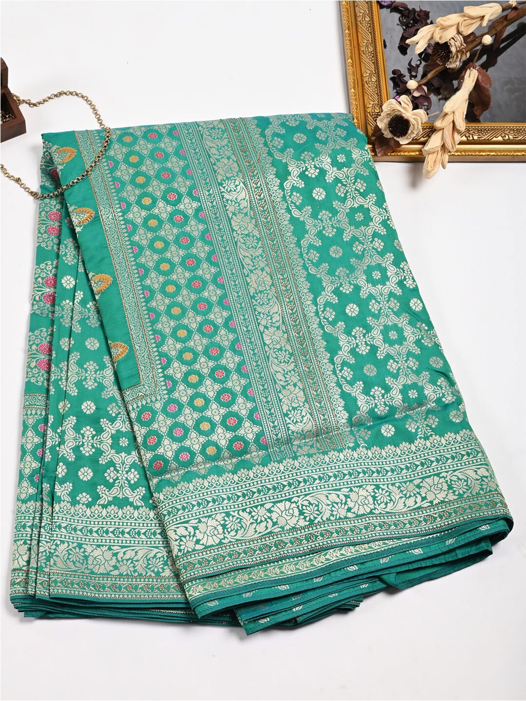 

Meena Bazaar Green & Silver-Toned Woven Design Zari Pure Silk Saree