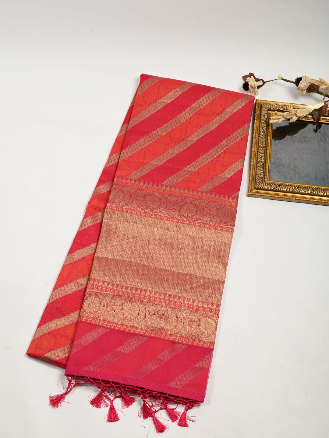 

Meena Bazaar Pink & Gold-Toned Woven Design Zari Pure Cotton Saree