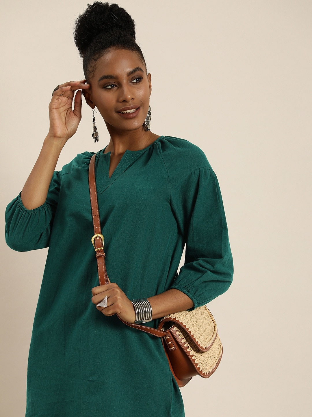 

Taavi Green Woven Legacy Puff Sleeves Cotton Linen Short Kurti