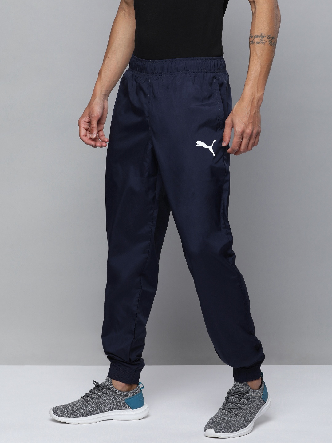 

Puma Men Solid Mid Rise Woven Joggers, Navy blue