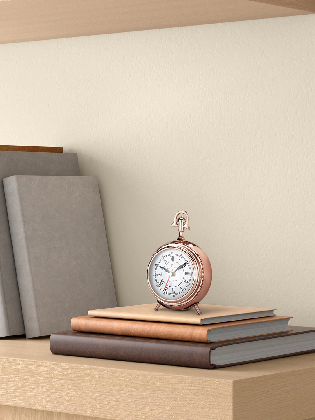 

Living scapes by Pantaloons Rose Gold Toned Analogue Contemporary Table Clock