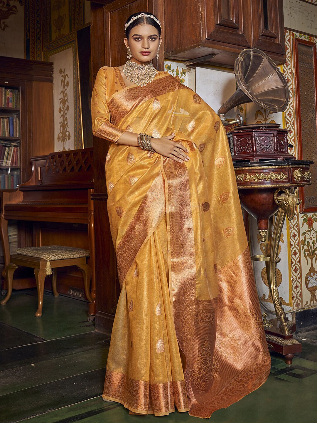 

Satrani Ethnic Motifs Woven Design Zari Banarasi Saree, Yellow