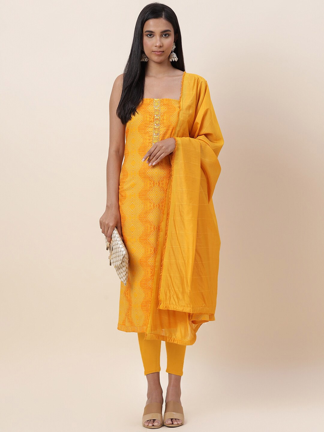 

Meena Bazaar Yellow Printed Pure Cotton Unstitched Dress Material