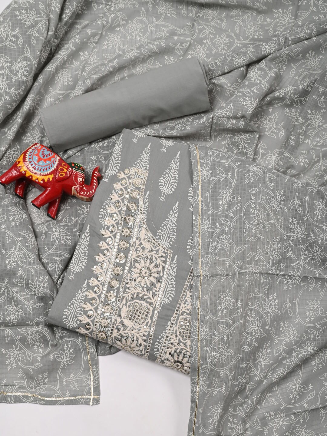 

Meena Bazaar Grey & White Embroidered Pure Cotton Unstitched Dress Material