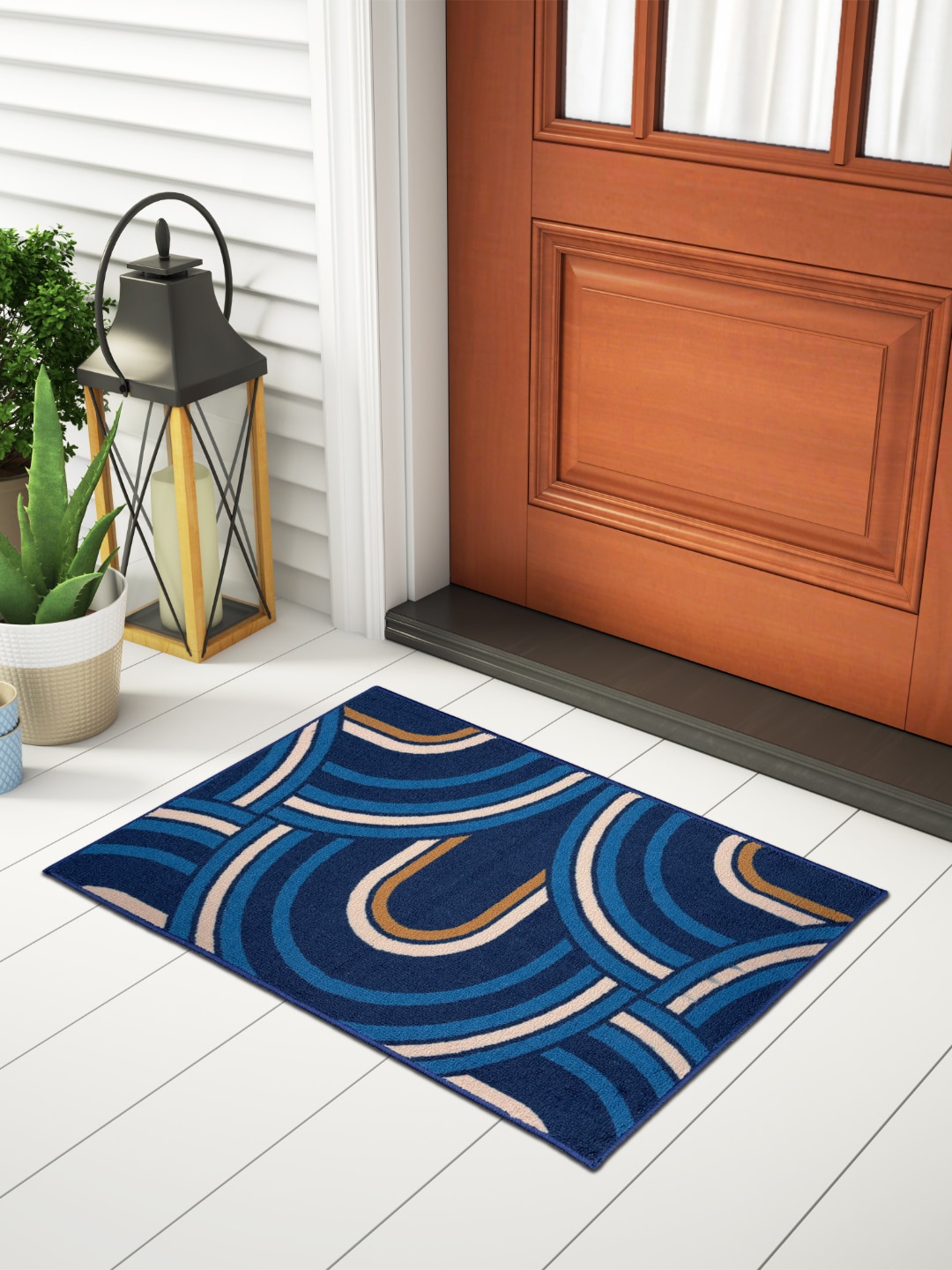 

Welspun Blue & Brown Patterned 1306 GSM Fade Resistant Rectangular Doormat