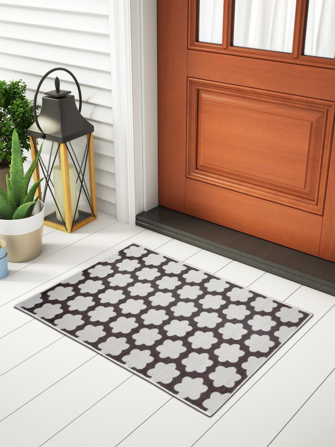 

Welspun Brown Printed 1306 GSM Fade Resistant Doormat