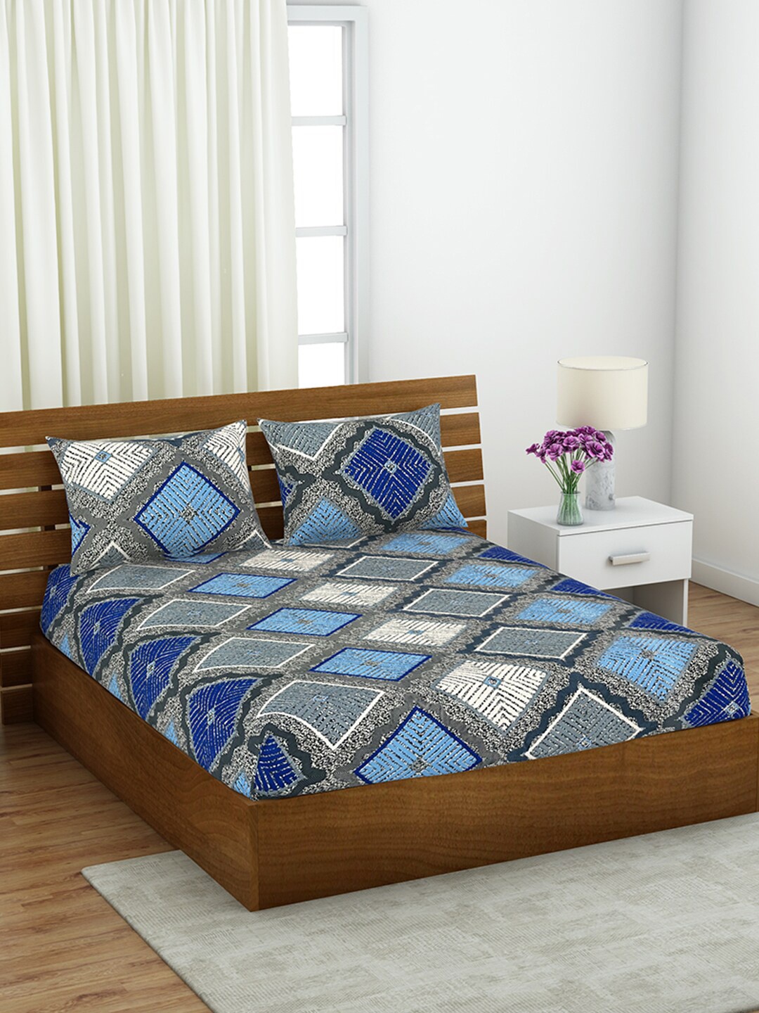 

Welspun Shimmer Blue & Off White Printed 144 TC Queen Bedsheet with 2 Pillow Covers