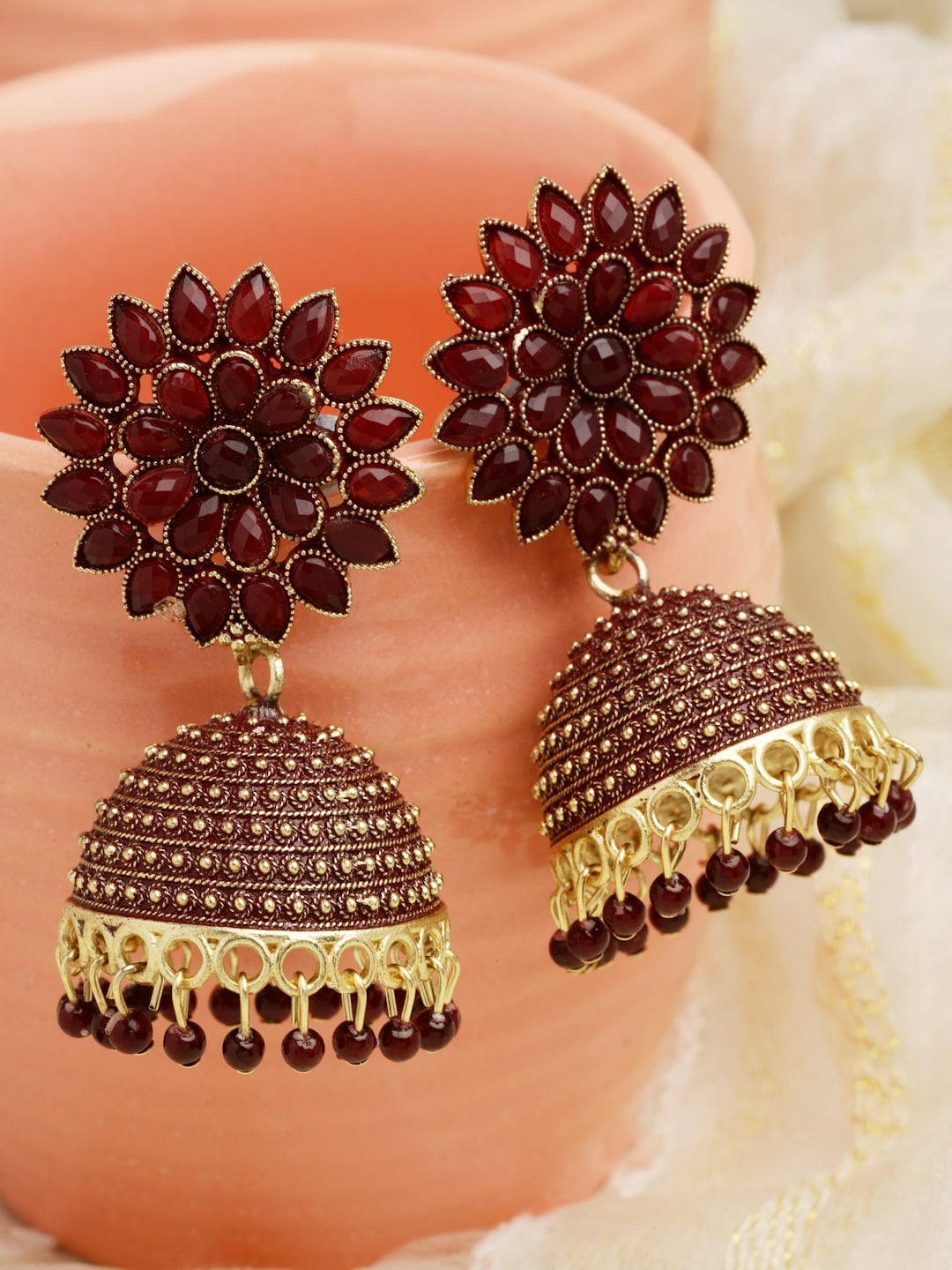 

Moedbuille Gold-Plated Crystals Studded Floral Design Meenakari Jhumkas Earrings, Maroon