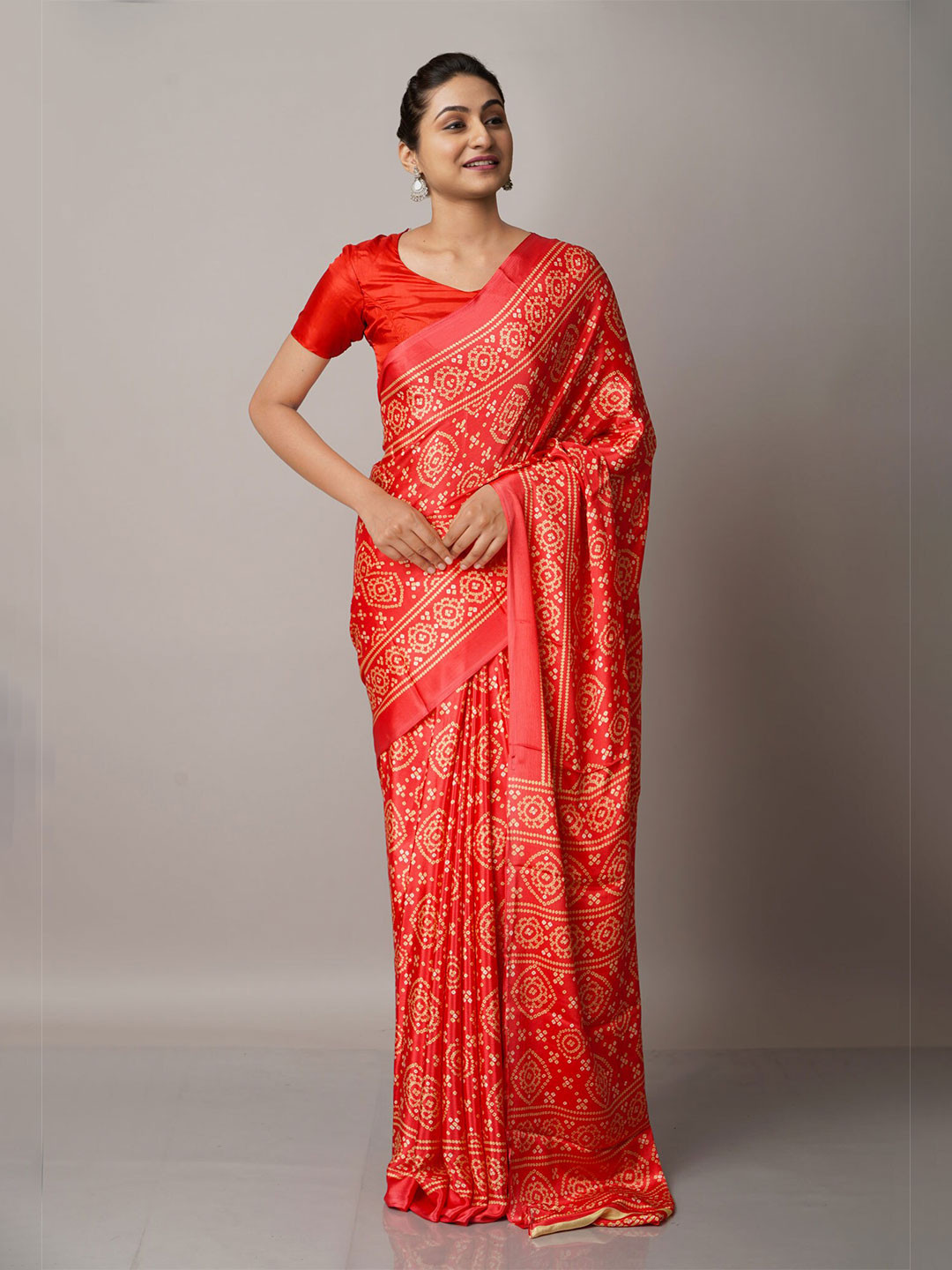 

Unnati Silks Pink & White Bandhani Saree