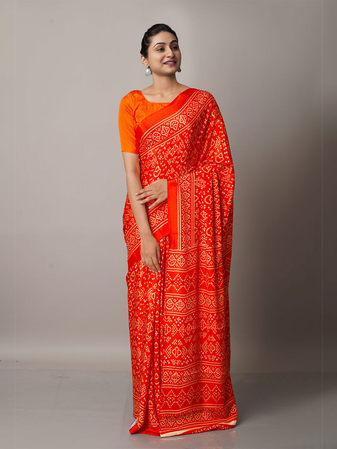 

Unnati Silks Red & White Bandhani Saree