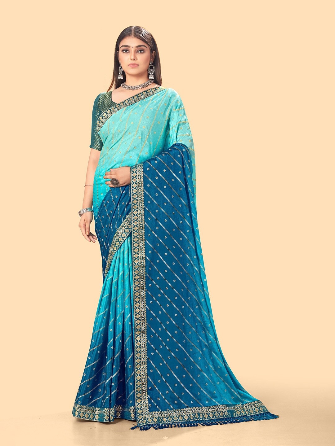 

KALINI Teal & Blue Woven Design Zari Leheriya Saree