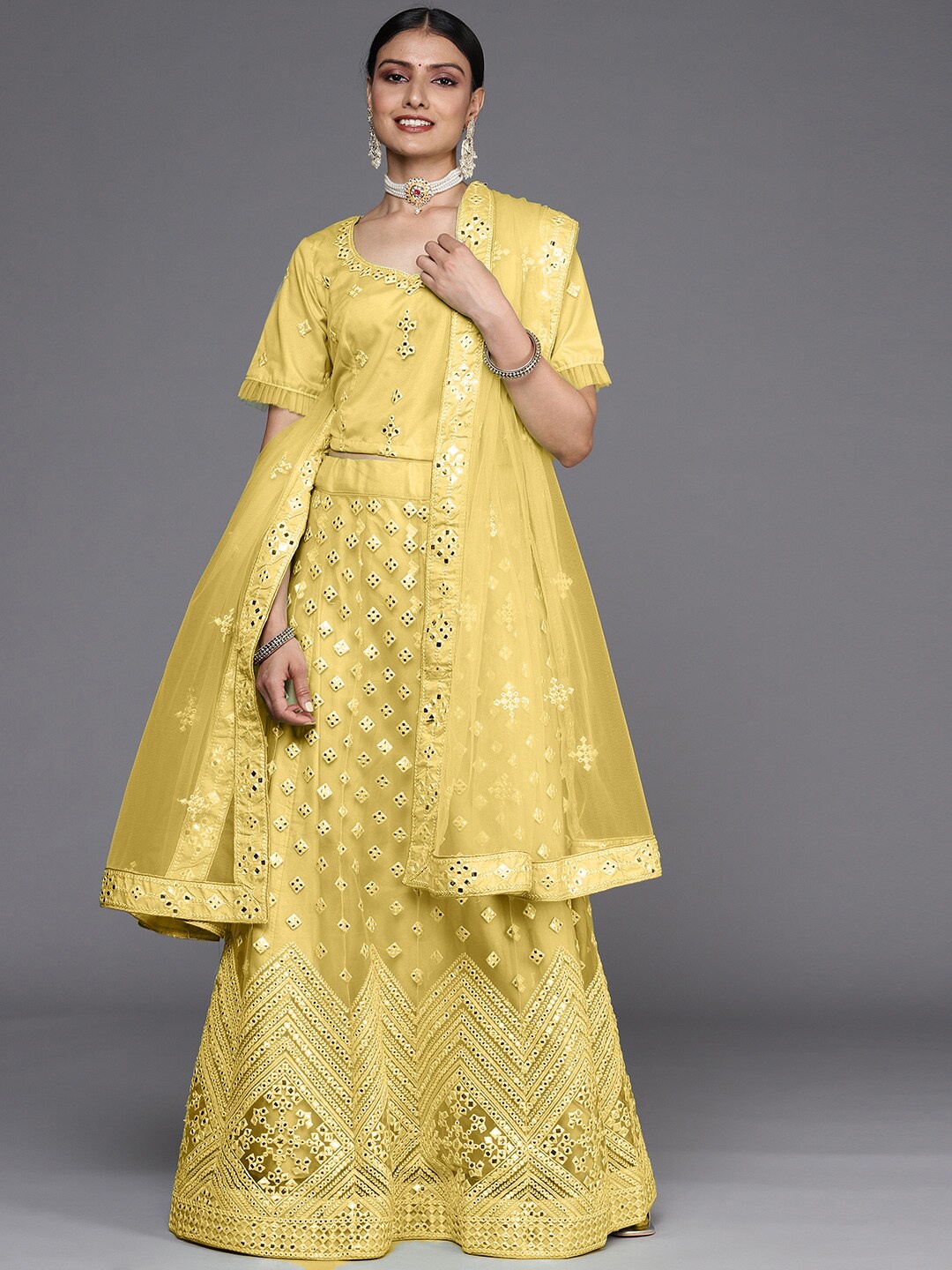 

Chhabra 555 Semi-Stitched Mirror Embellished Chevron Pattern Lehenga Choli, Yellow