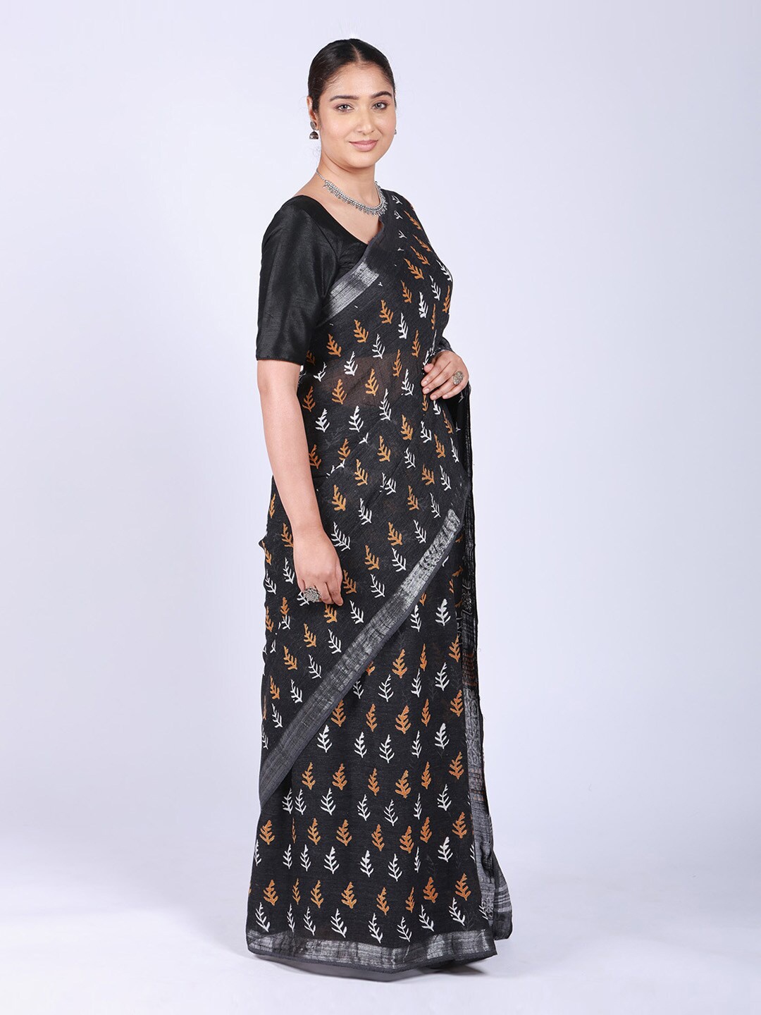 

ReshaWeaves Black & Brown Ethnic Motifs Zari Pure Linen Saree