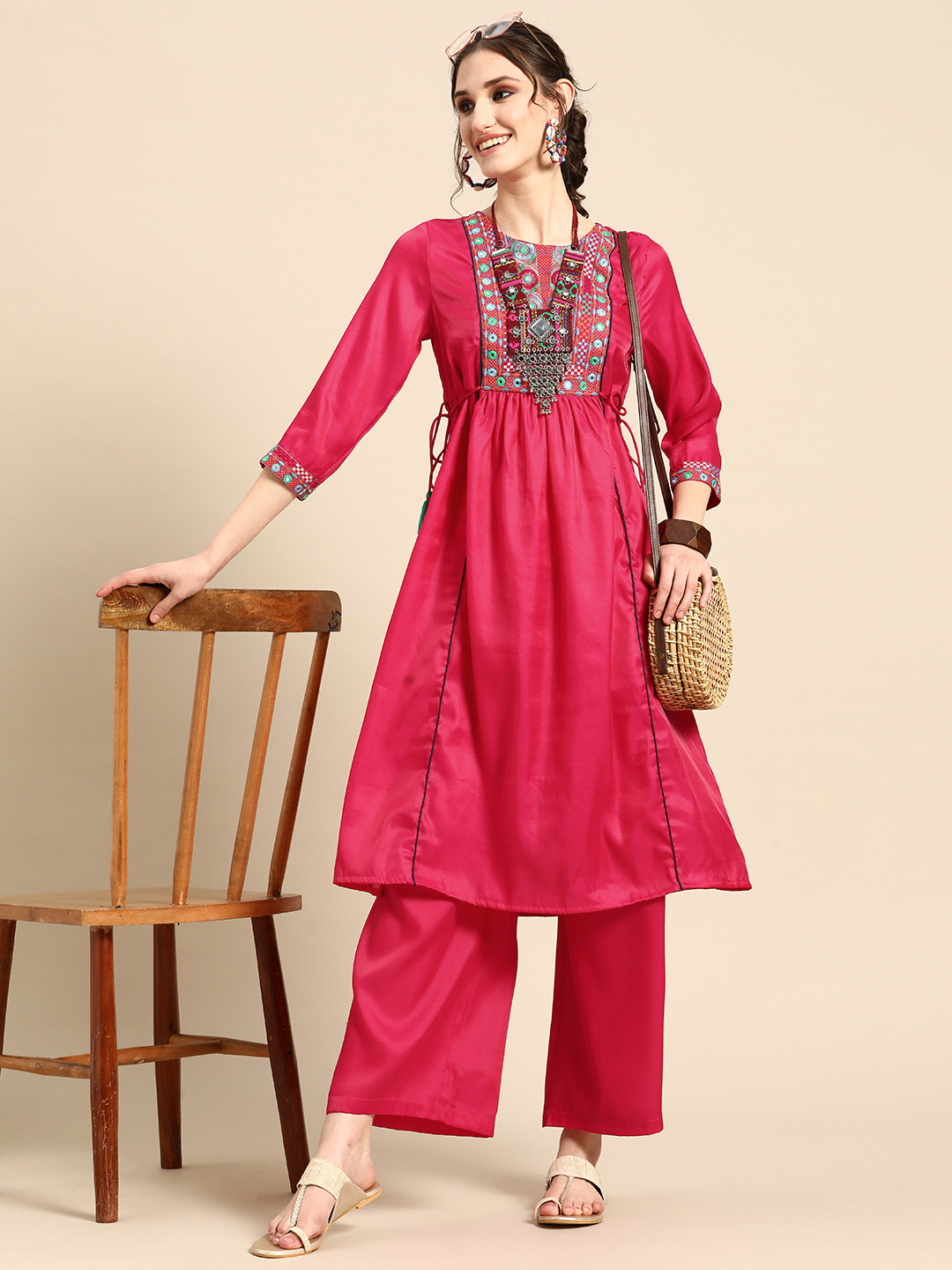 

Sangria Embroidered Pleated Mirror Work Kurta With Palazzos, Pink