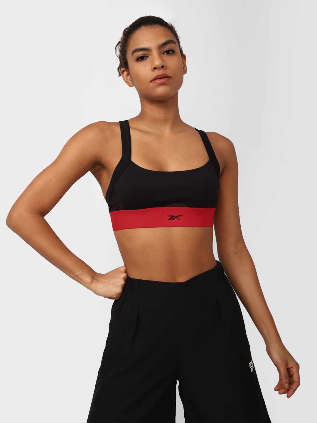 

Reebok Women Brand Logo Printed Cardi B Bralette, Black