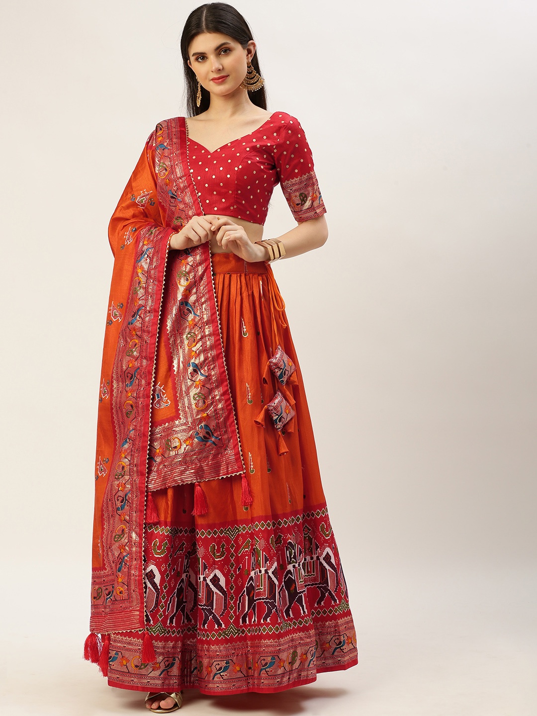 

LOOKNBOOK ART Orange Dola Silk With Patola Foil Printed Lehenga Choli