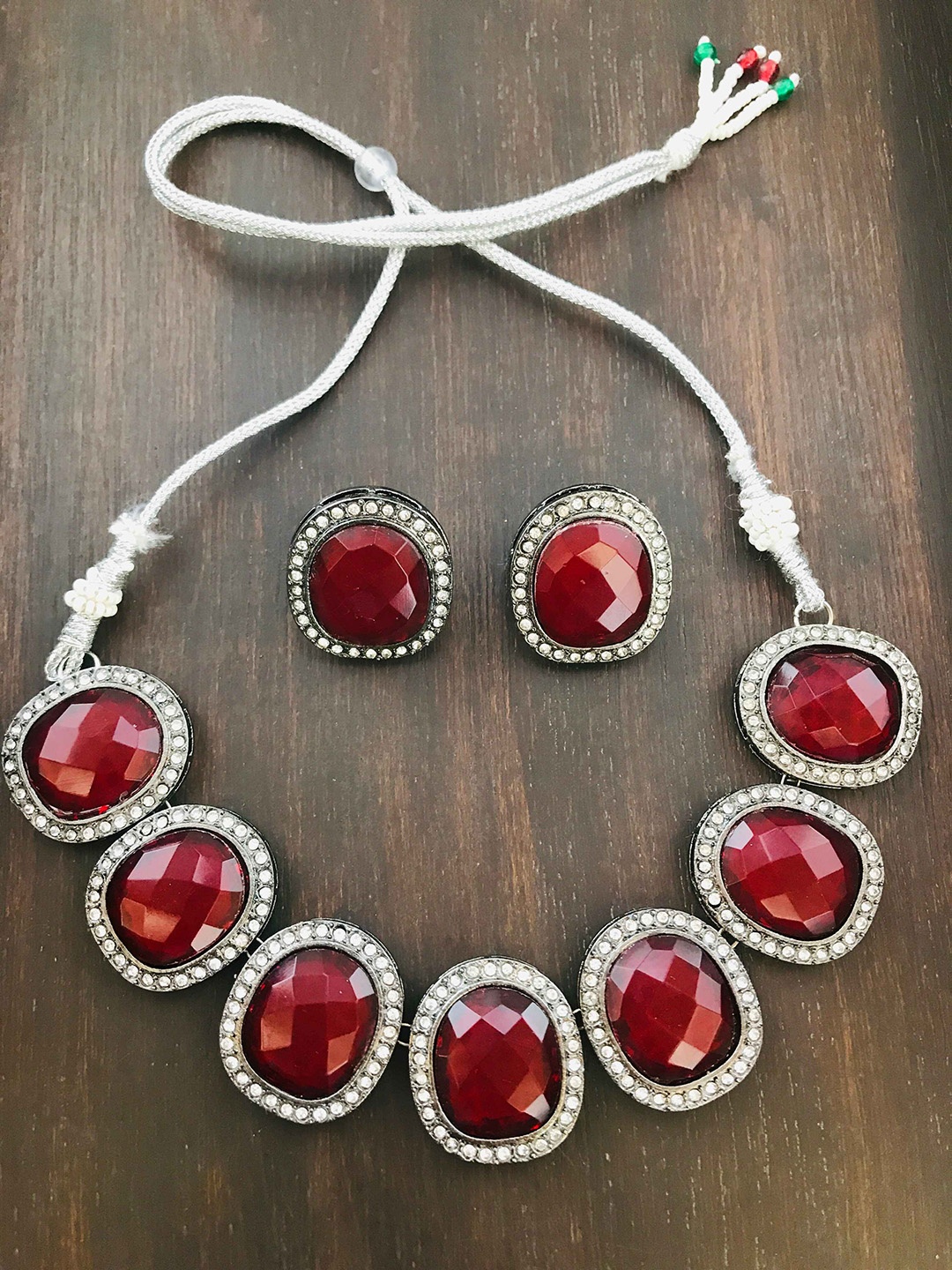

The Opal Factory Gold-Plated Uncut AD-Studded Alloy Jewellery Set, Red