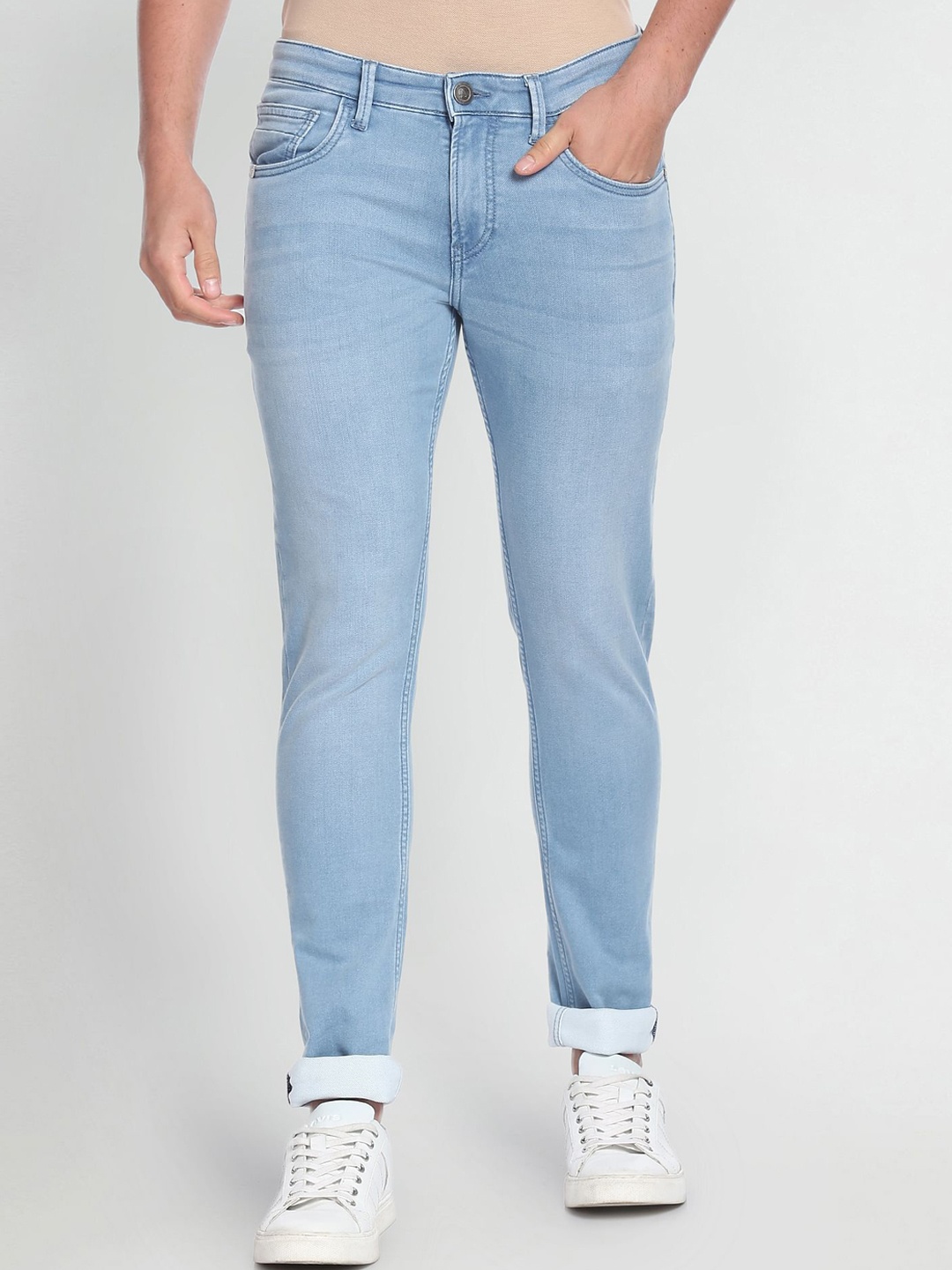 

Arrow Sport Men Slim Fit Low-Rise Clean Look Stretchable Cuffed Hem Light Fade Jeans, Blue