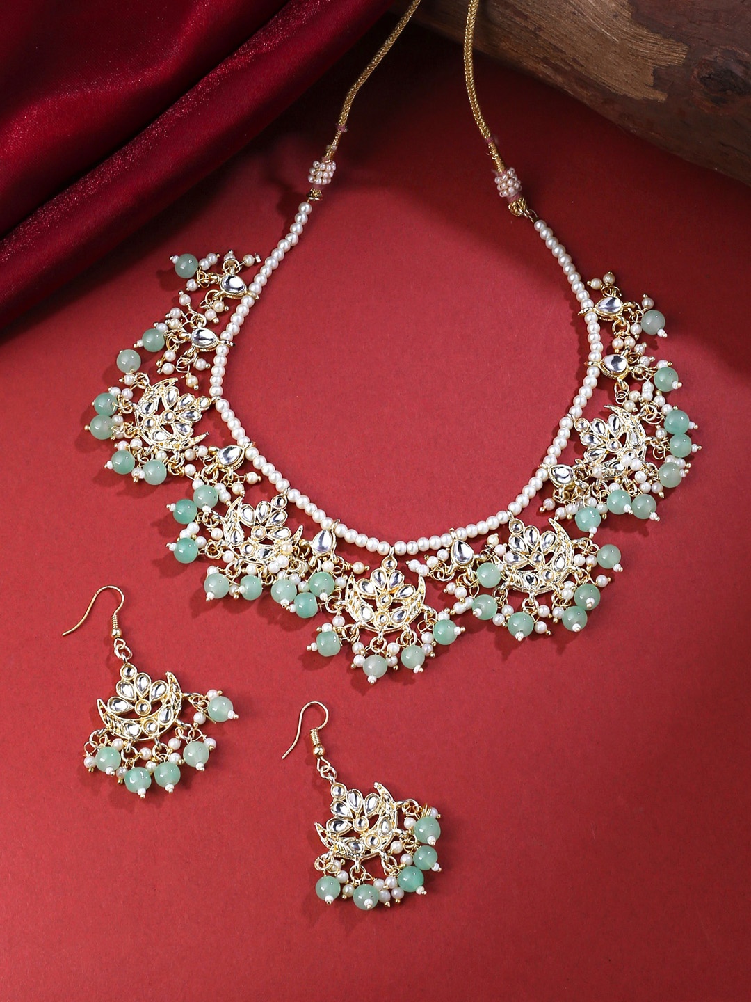 

Yellow Chimes Gold-Plated Kundan-Studded & Pearl Beaded Jewellery Set, Sea green