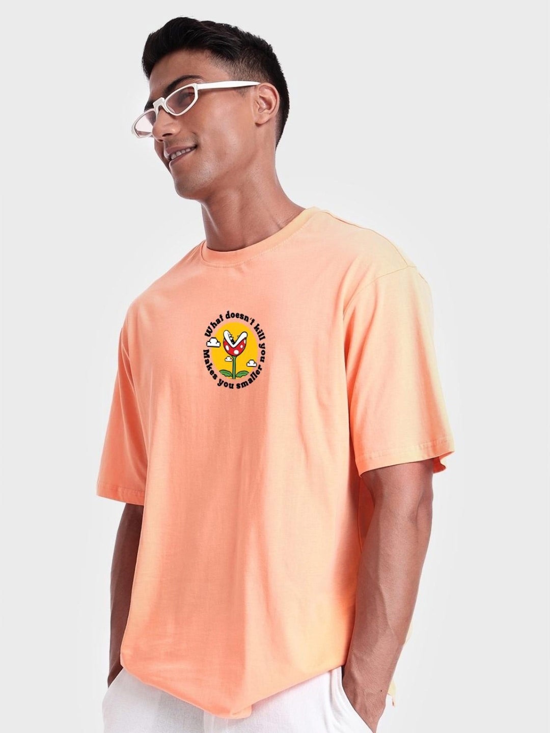 

Bewakoof Graphic Printed Drop-Shoulder Sleeves Cotton Loose T-shirt, Orange