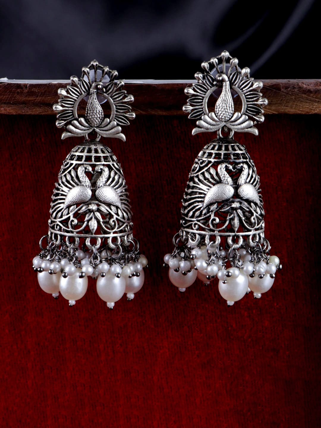 

Krelin Silver-Plated Peacock Shape Oxidised Moti Jhumkas