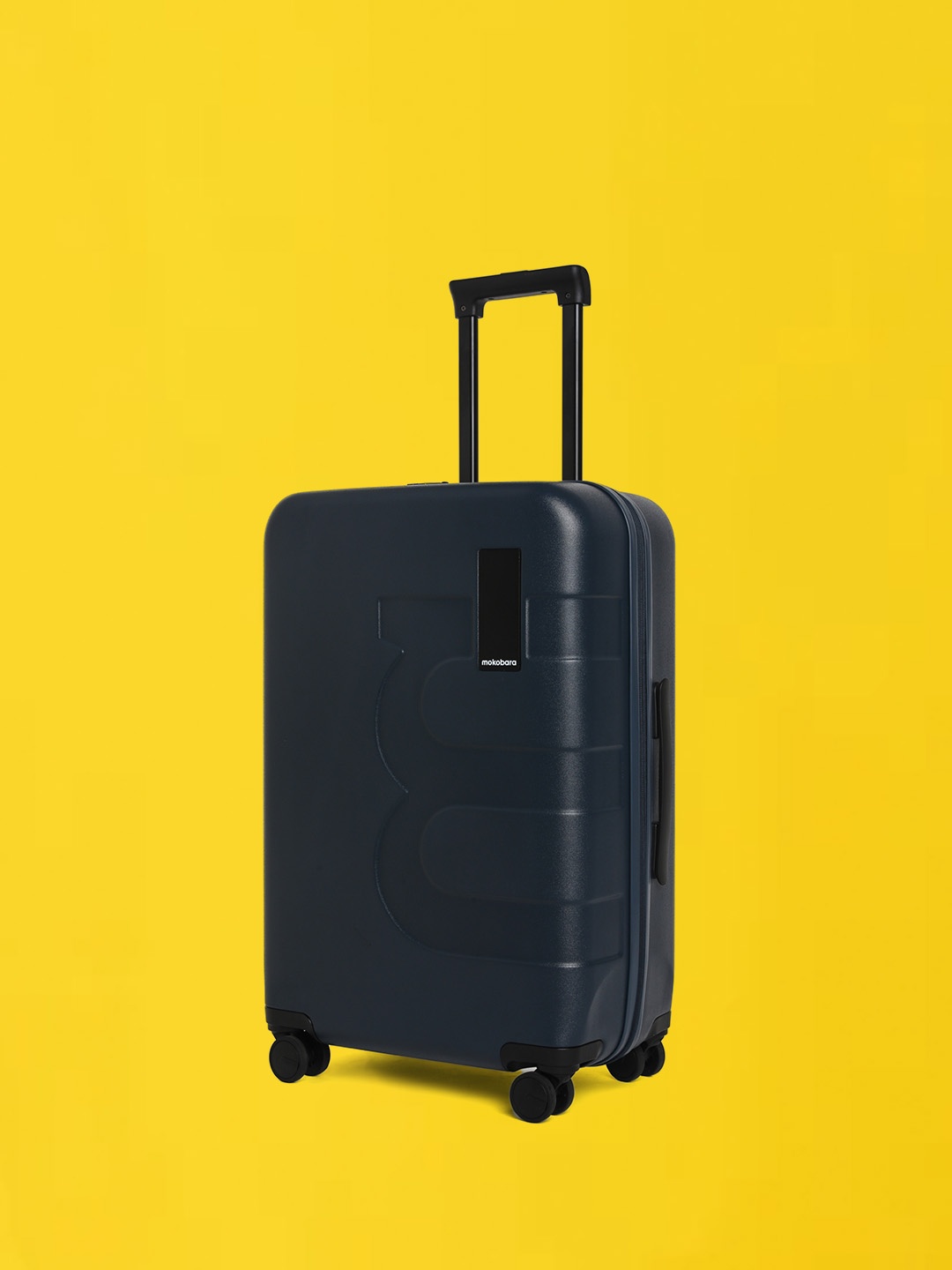 

MOKOBARA The Em Textured Hard-Sided Medium Trolley Suitcase, Navy blue