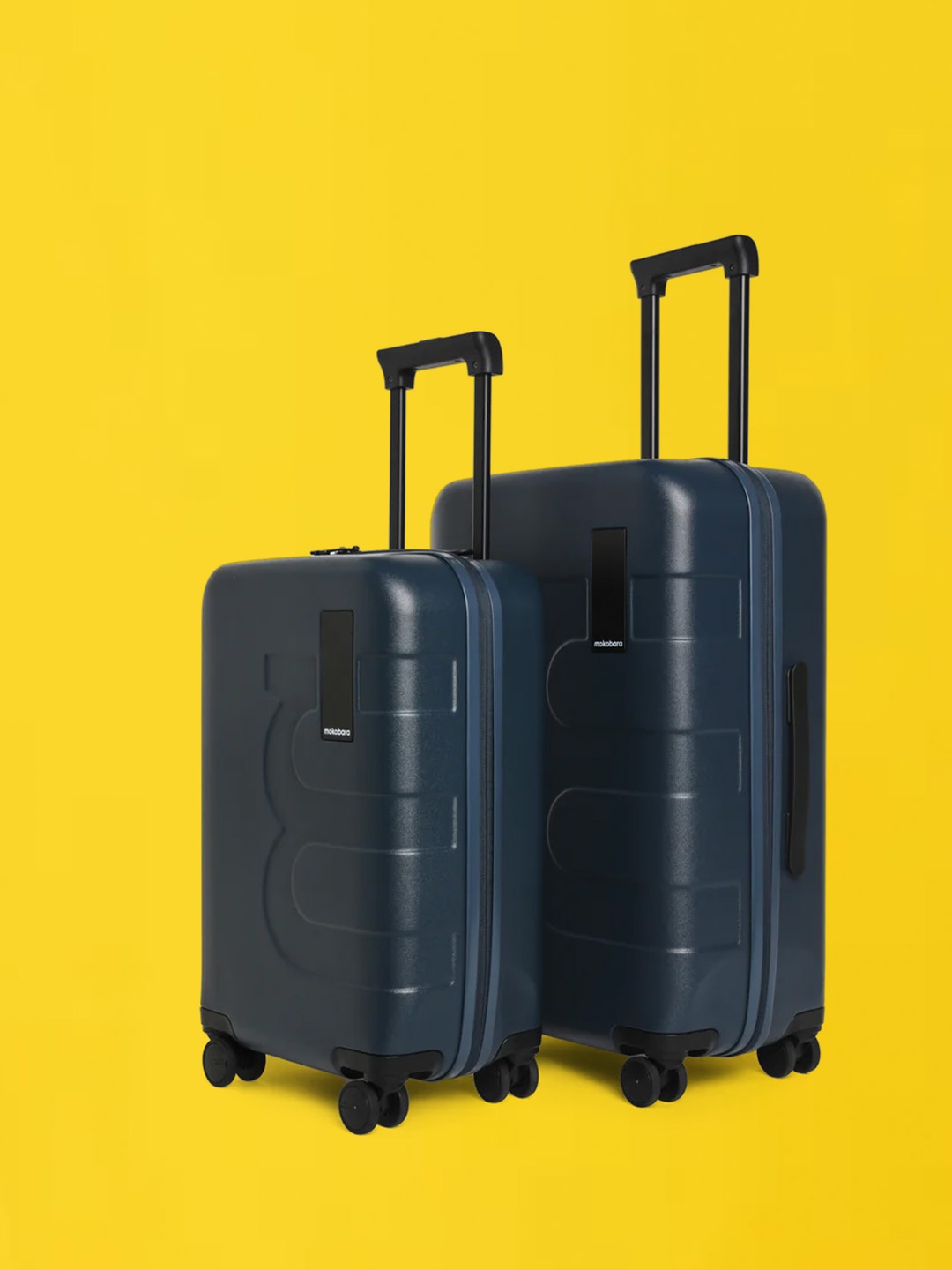 

MOKOBARA The Em Set Of 2 Textured Small & Medium Hard-Sided Trolley Suitcases, Navy blue