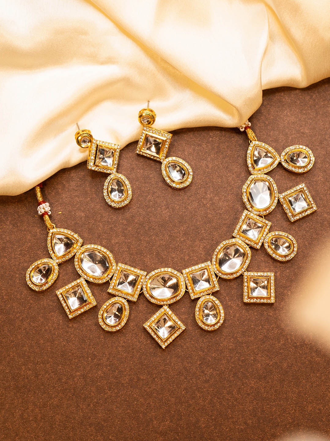 

Yellow Chimes Gold-Plated Kundan Studded Jewellery Set