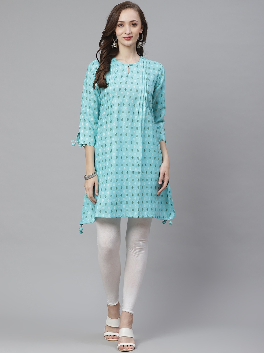

Bhama Couture Keyhole Neck Asymmetric Ethnic Motifs Printed A-Line Cotton Kurta, Turquoise blue