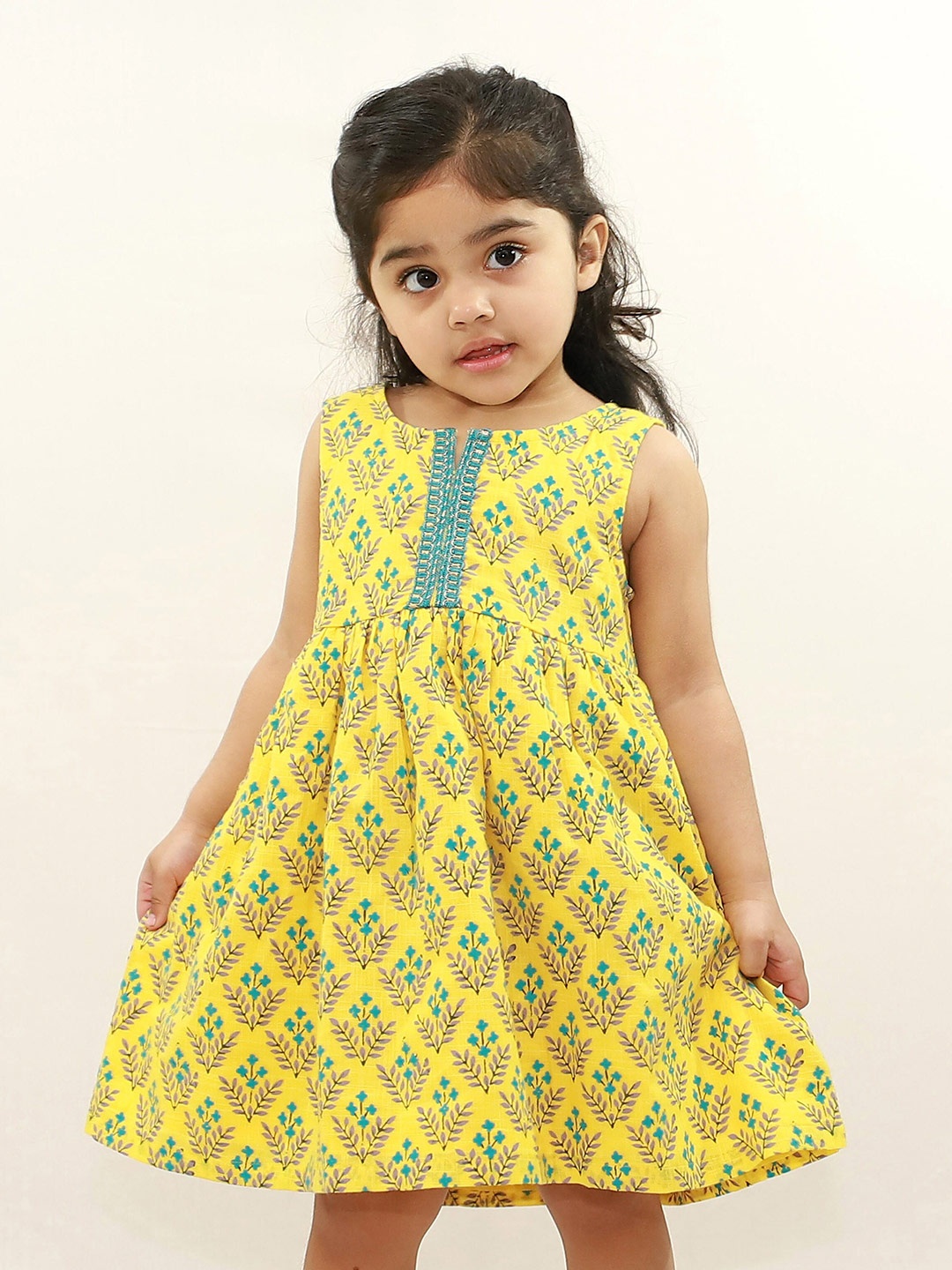 

Campana Girls Round Neck Ethnic Motifs Printed Cotton Fit And Flare Dress, Yellow