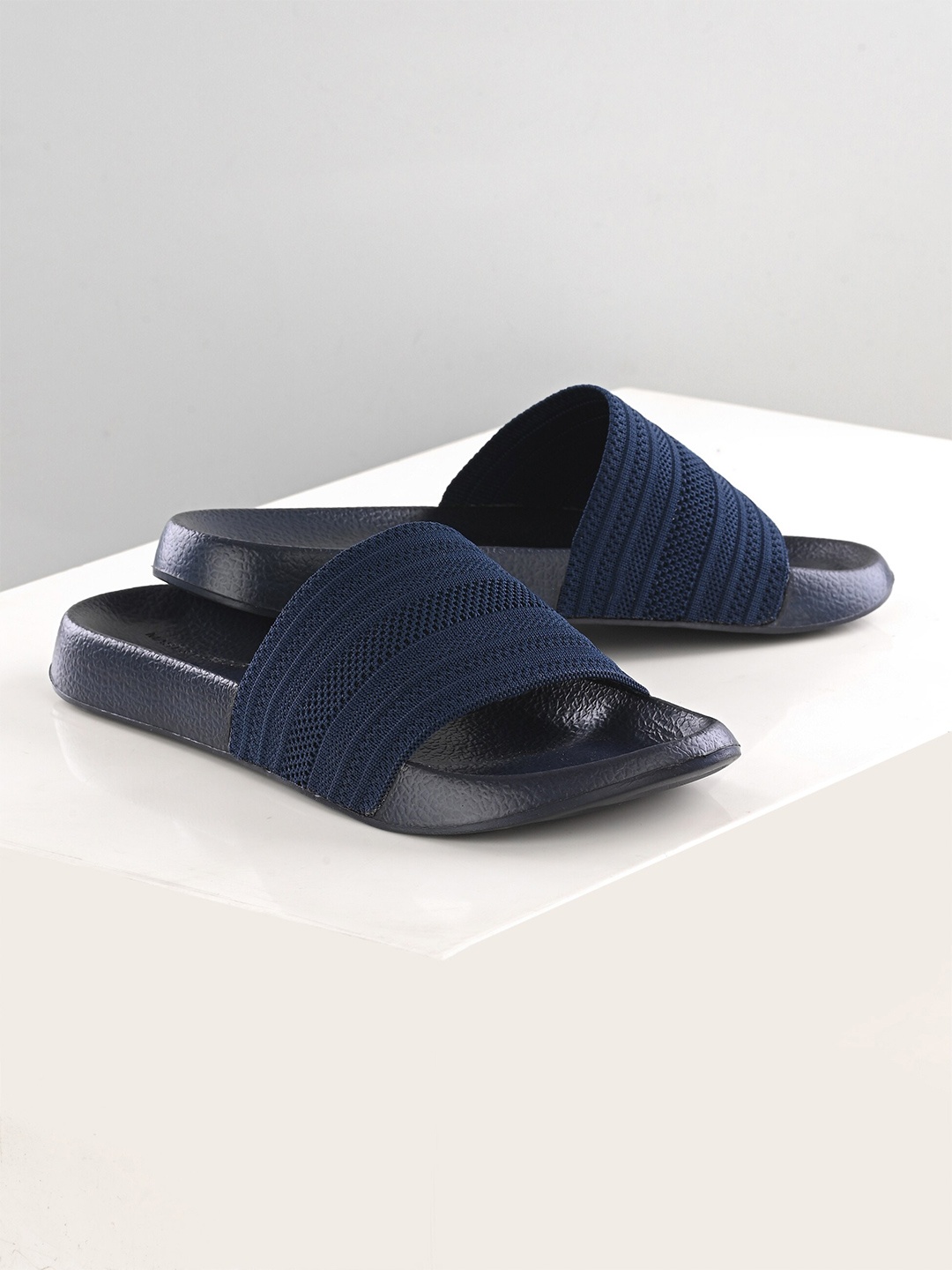 

Mast & Harbour Men Self Design Fabric Comfort -Fit Sliders, Blue