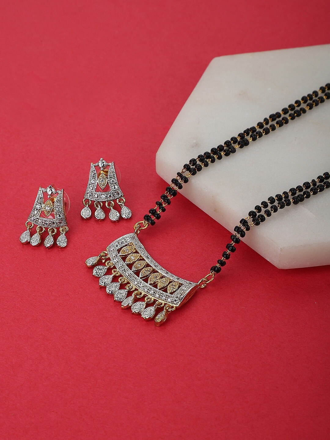 

Carlton London Gold Plated Stone-Studded Mangalsutra & Earrings Set
