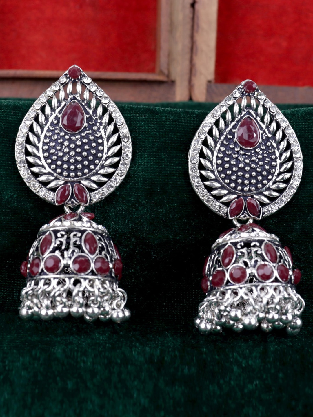 

VAGHBHATT Silver Plated Dome Shaped Stone Studded Jhumkas Earrings, Maroon