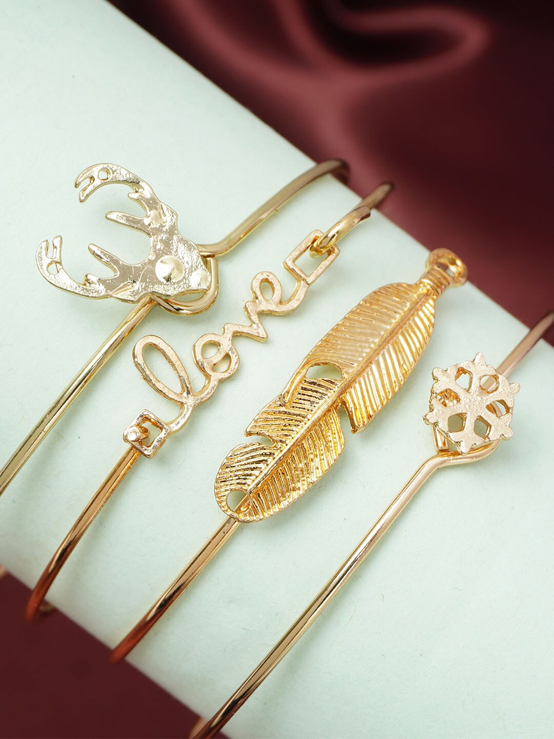 

Ferosh Women Set of 4 Gold-Plated Reindeer & Snowflake Kada Bracelet, White