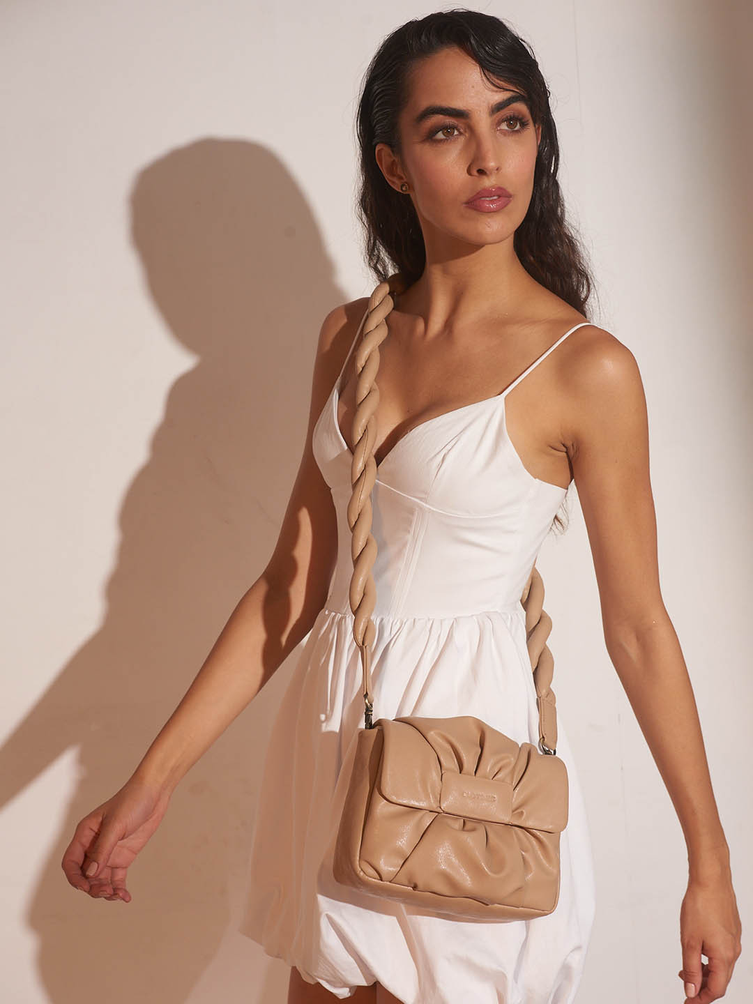 

Clotche Beige Textured Leather Structured Sling Bag