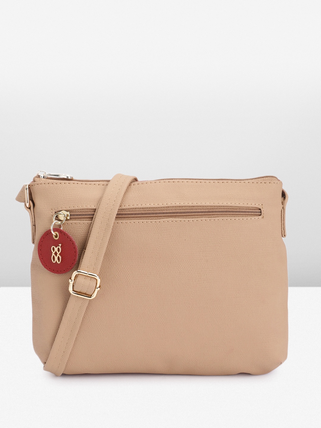 

Baggit Women Solid Sling Bag, Beige