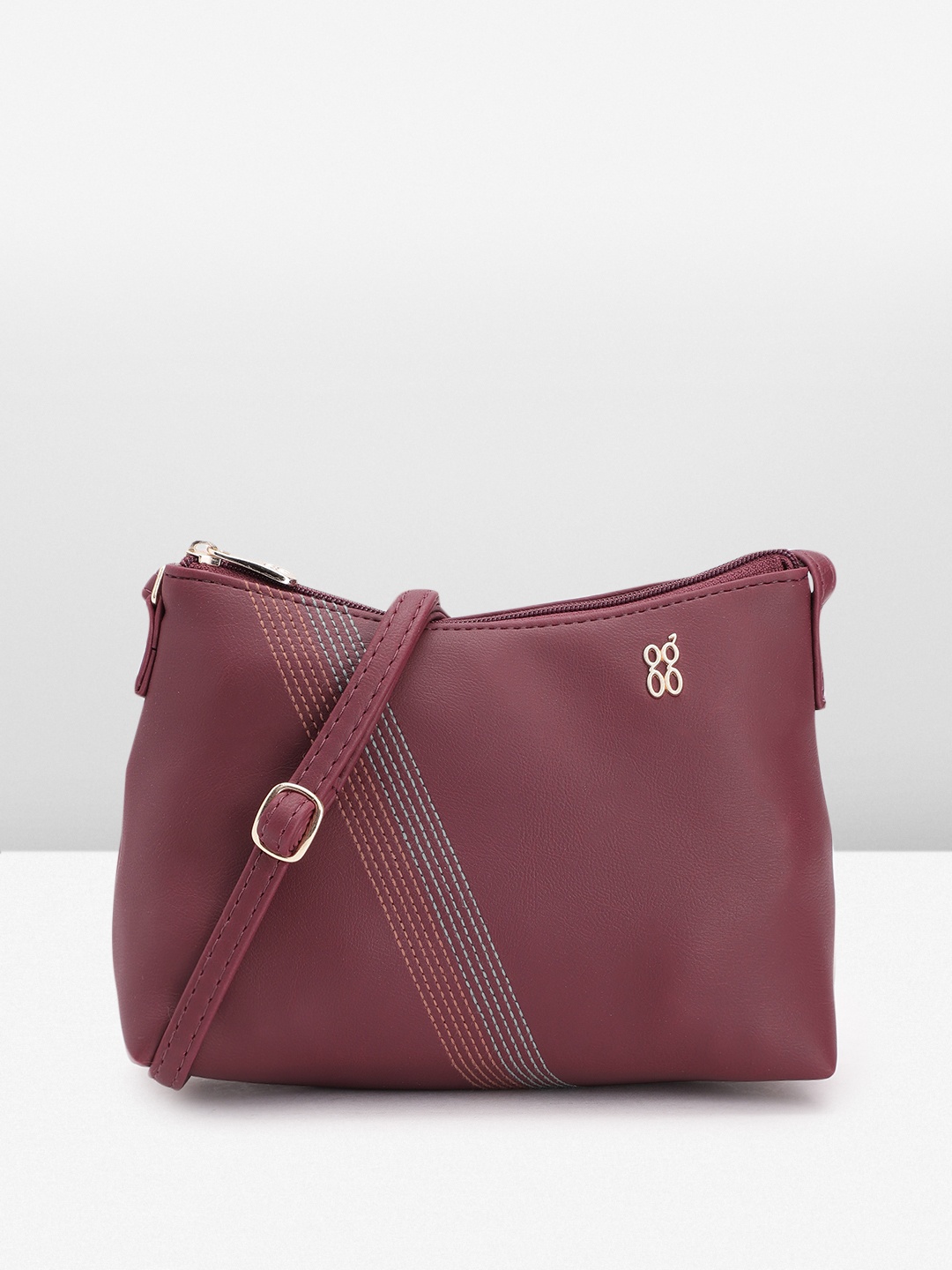 

Baggit Women Solid Sling Bag, Maroon