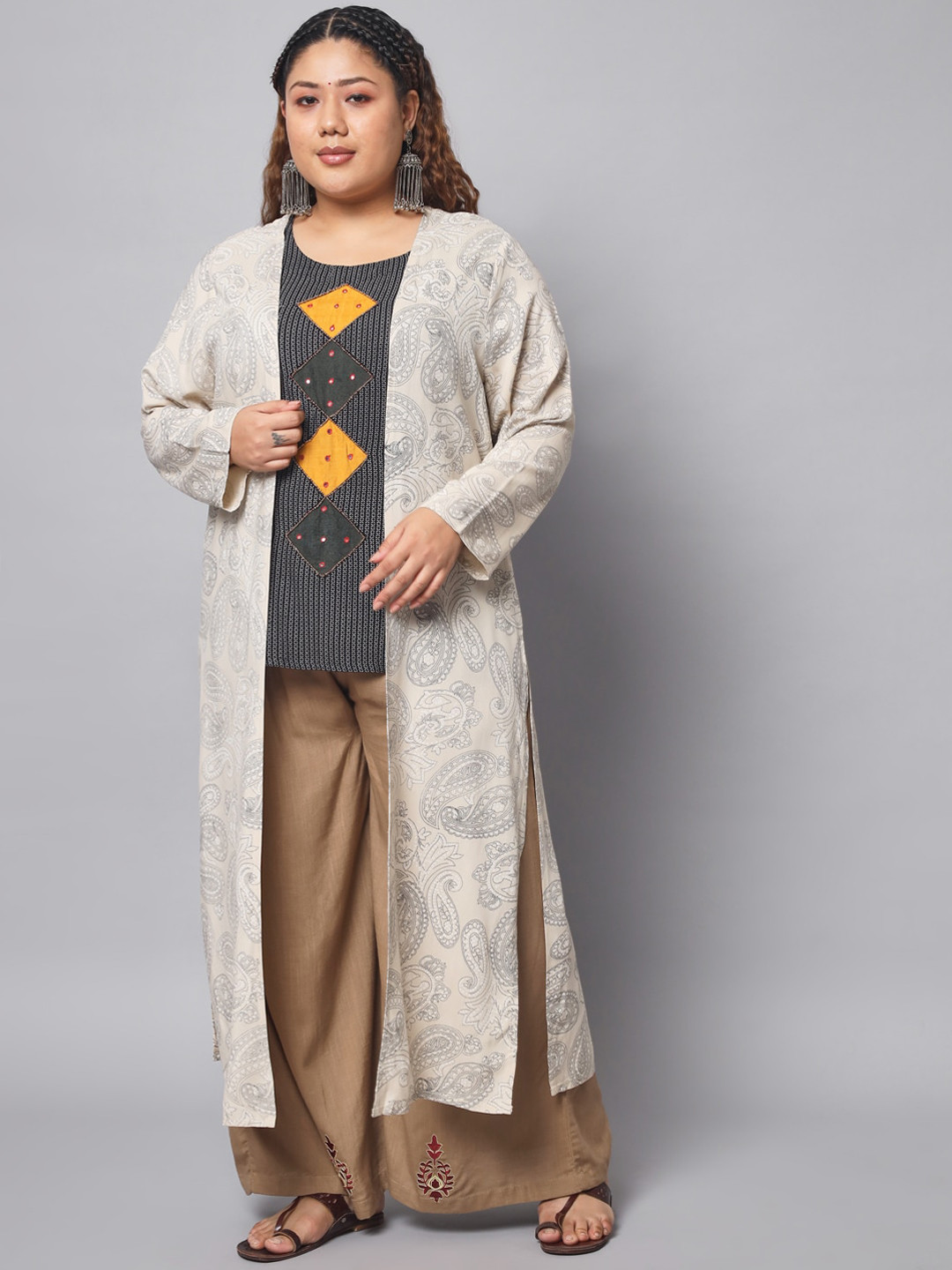 

Pankvi Plus Size Ethnic Motifs Printed Mirror Work Top with Palazzos & Jacket, Black