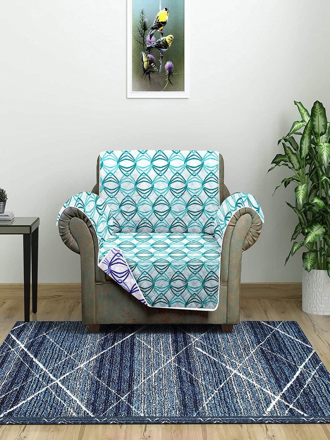 

Cortina Turquoise-Blue & White Printed One Seater Reversible Sofa Cover With Arm