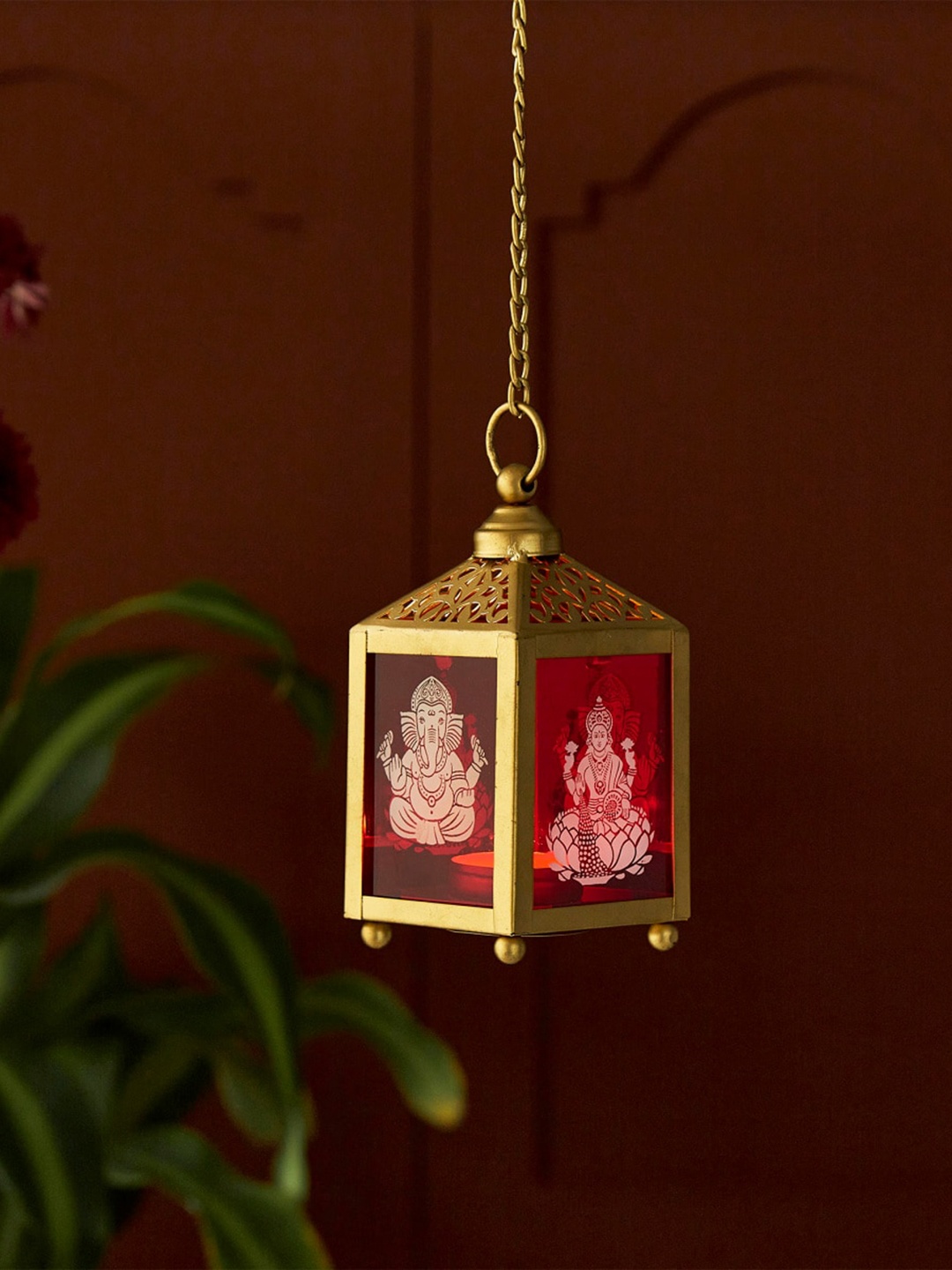 

Home Centre Gold Toned & Red Dhyana Ganesha And Lakshmi Hanging T-Light Holder