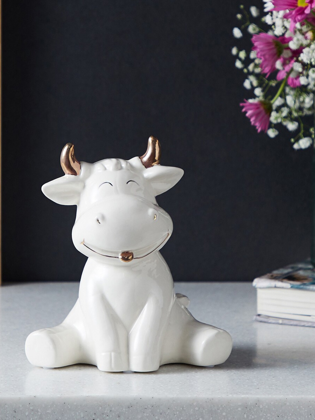 

Home Centre Brighton White & Gold-Toned Brighton Textured Cow Hands Down Ceramic Showpiece