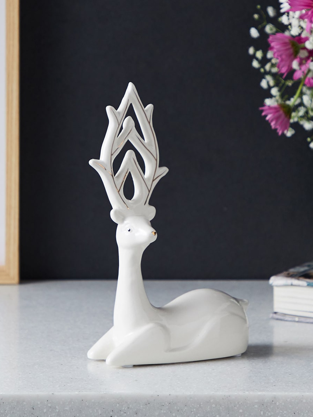 

Home Centre Brighton White Textured Sitting Reindeer Ceramic Showpiece